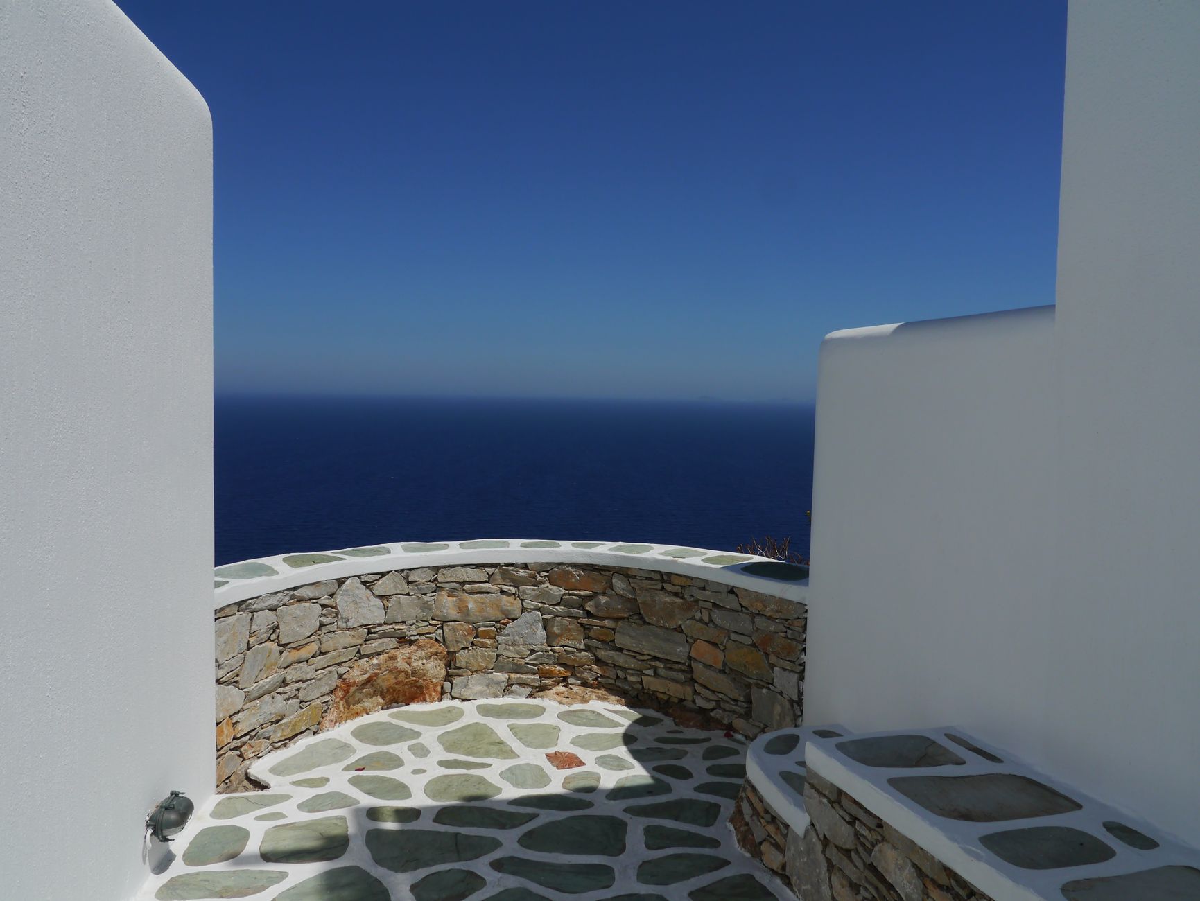 Coastline whitewashed terrace overlooking calm water