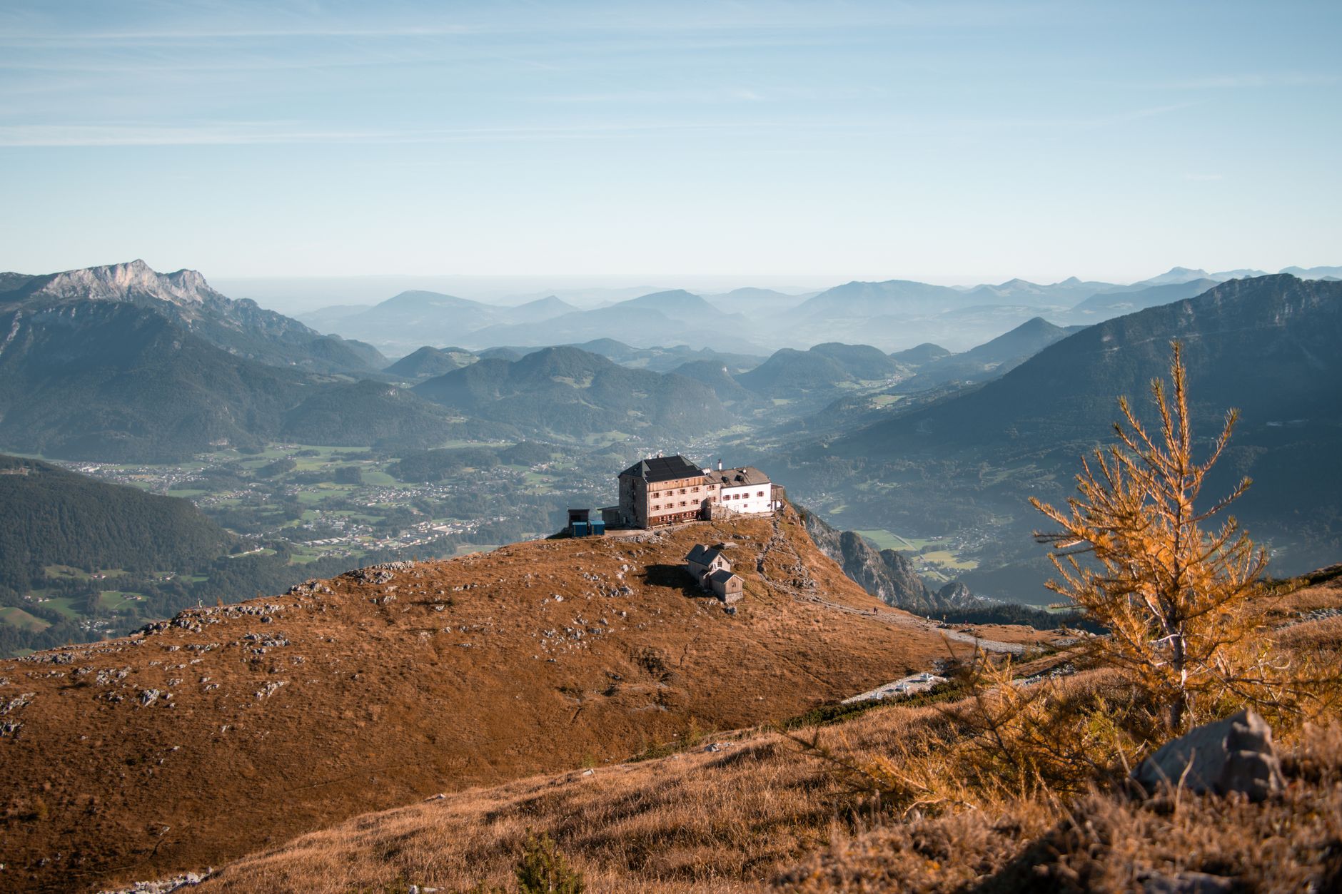 Wooden alpine retreat lodge surrounded by autumn trees