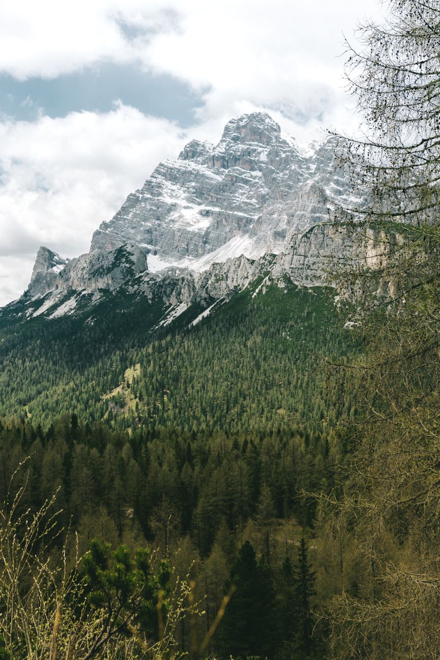 Dramatic alpine peaks above mist in Dolomites